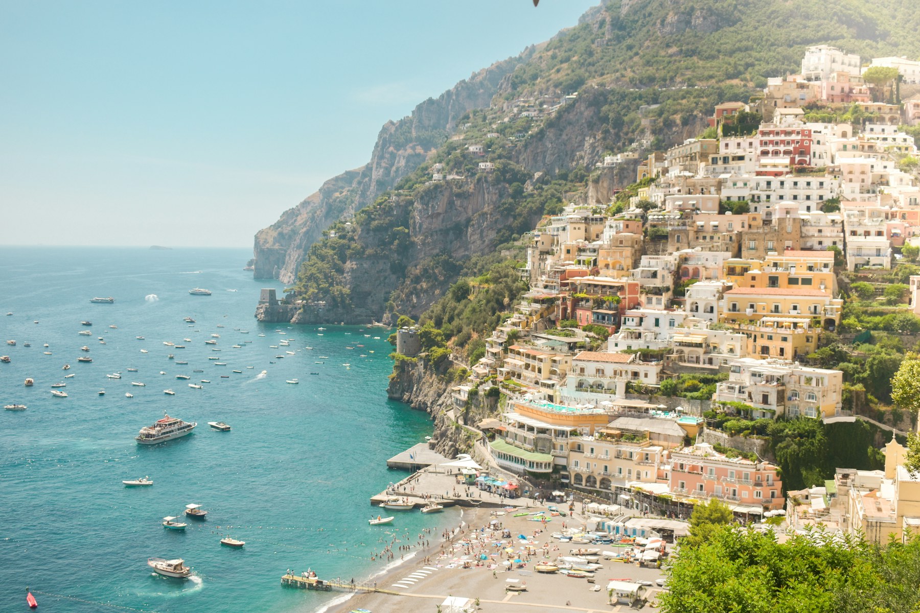 Pastel buildings climbing the hillside above the sea in Positano, on Italy’s Amalfi Coast