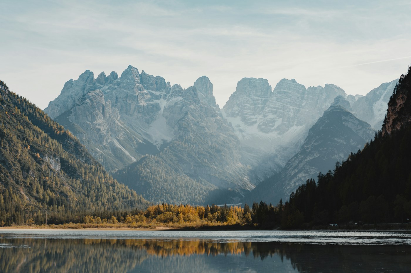 Still alpine water reflecting the mountain peaks of the Italian Dolomites